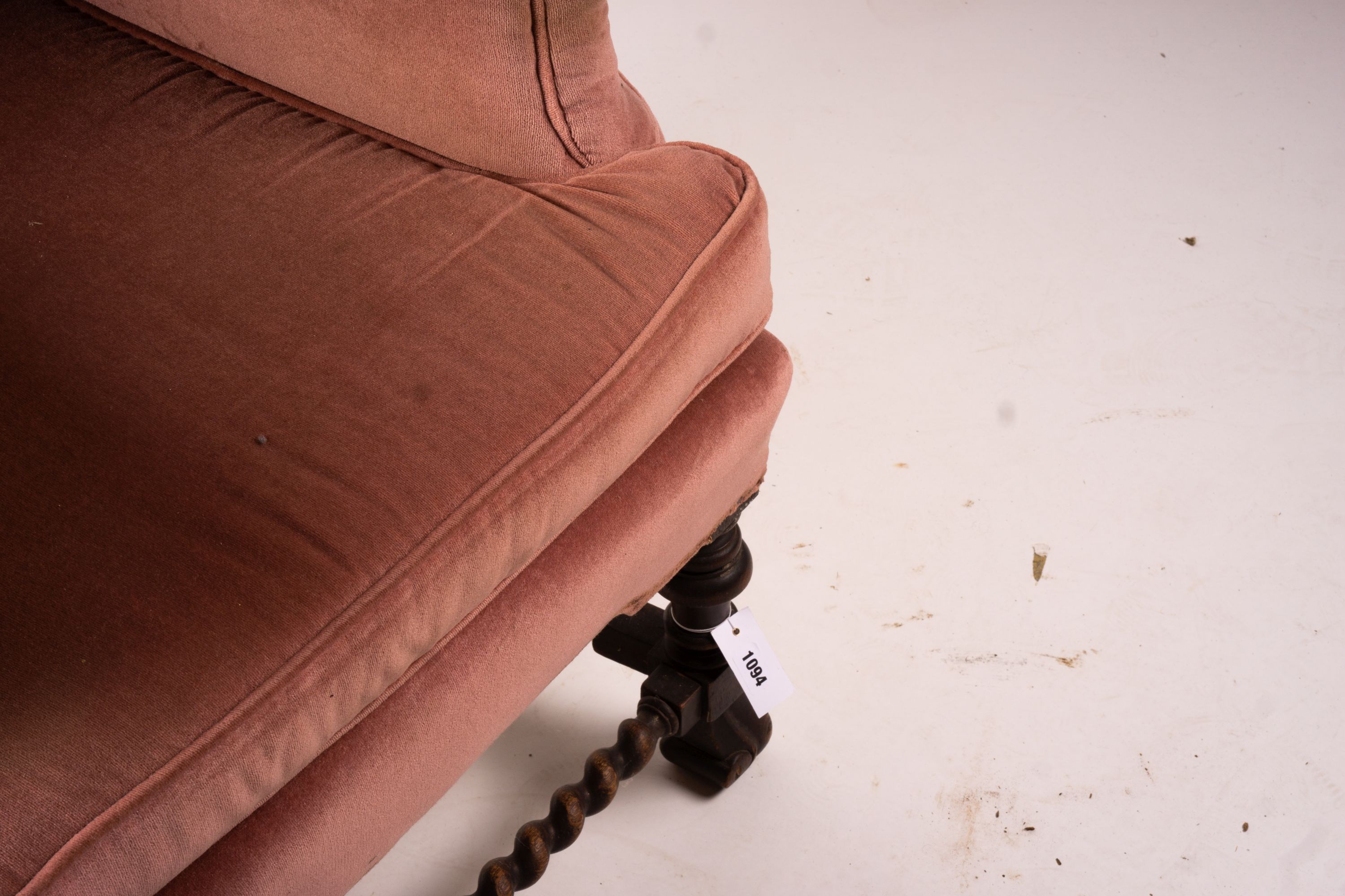 An early 20th century Jacobean revival upholstered wing armchair, width 84cm, depth 90cm, height 128cm